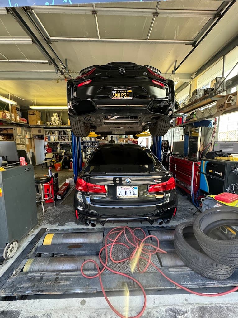 BMW i8 and M5 being serviced at Masonic Smog & Repair